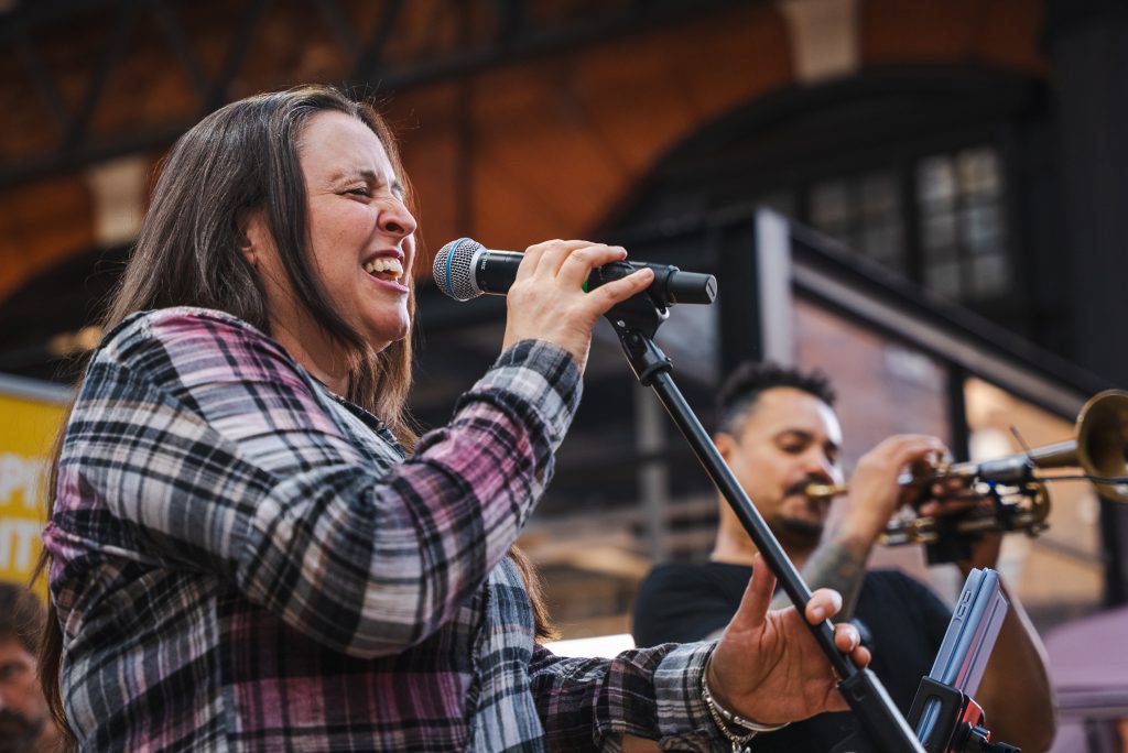 A singer performing at Old Spitalfields Market